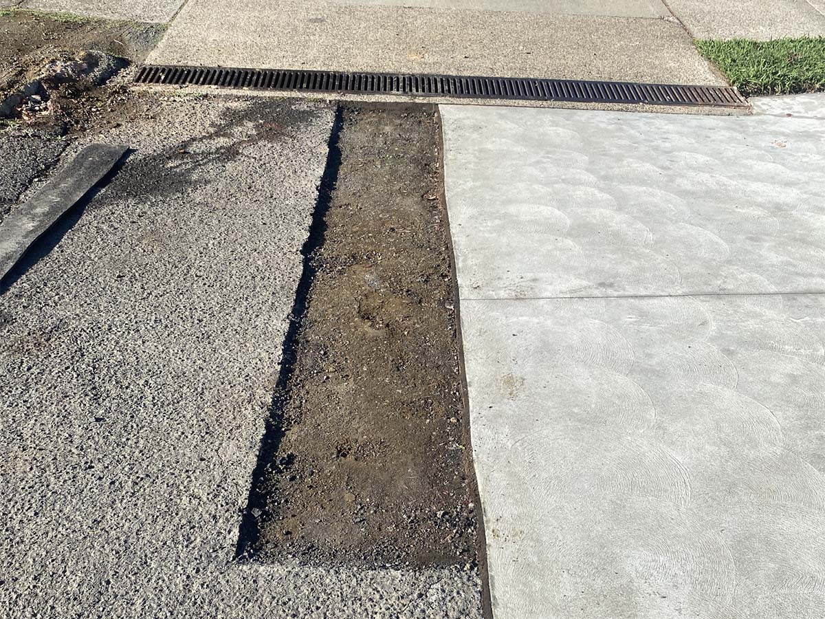 Before Image of Asphalt Cut and Replace Patch Repair for Techno Automotives in Rydalmere, New South Wales