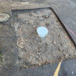 Before image of asphalt patch repair for Crystal Clear Plumbing in Hunters Hill, New South Wales