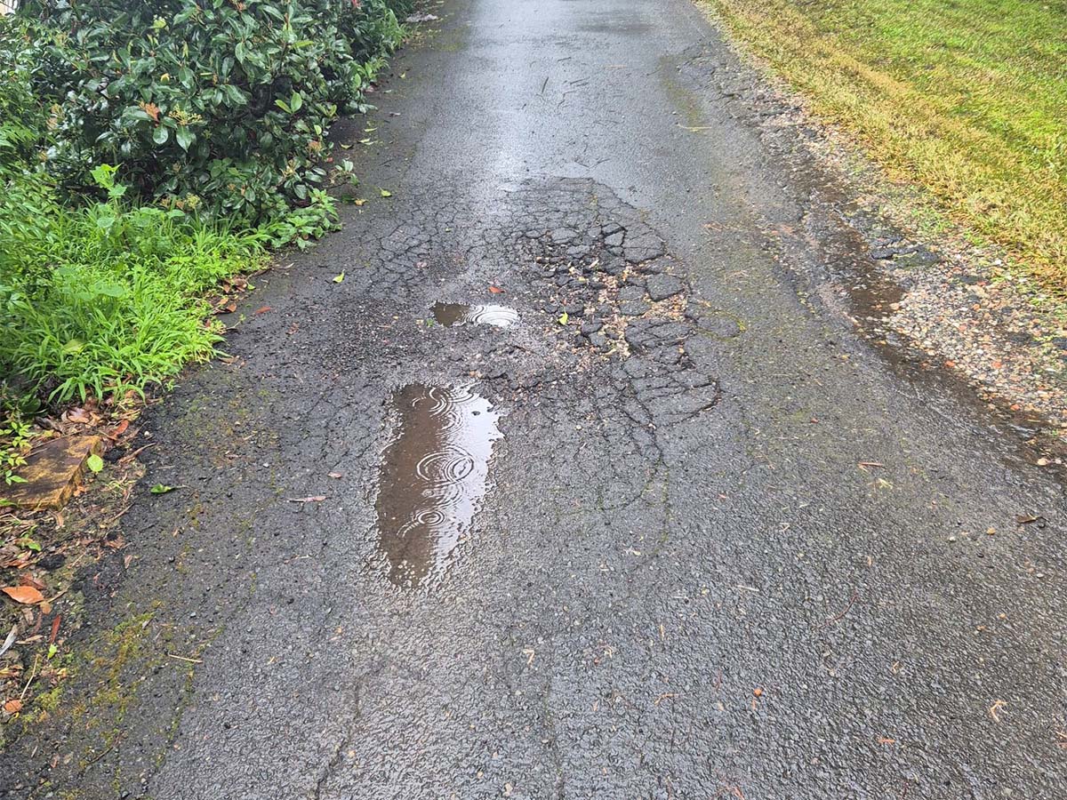 Before image of an asphalt patch repair at a private residence in Epping, New South Wales