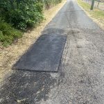 Completed asphalt patch repair on a driveway at a private residence in Dural, New South Wales
