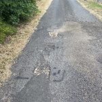 Before image of an asphalt patch repair on a driveway at a private residence in Dural, New South Wales