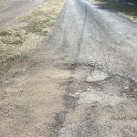 Before image of an asphalt patch repair on a driveway at a private residence in Dural, New South Wales