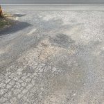 Before image of an asphalt patch repair on a driveway at a private residence in Dural, New South Wales