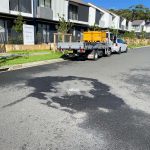 Before image of an Asphalt Cut & Replace road repair for Highland Stone Walls Pty Ltd in Warriewood, New South Wales